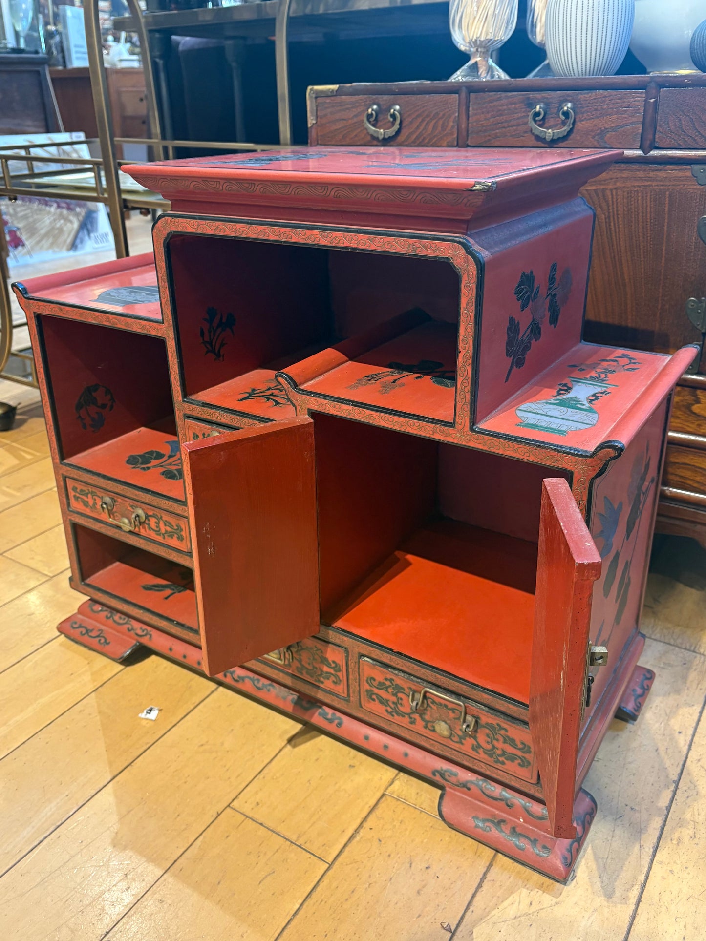 Low Red Painted Cabinet with Small Drawers and Nooks