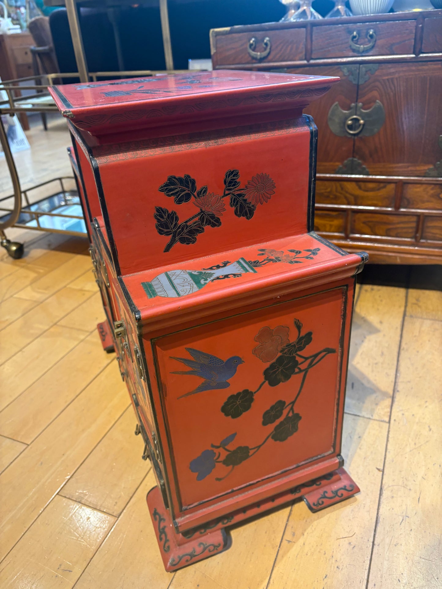 Low Red Painted Cabinet with Small Drawers and Nooks