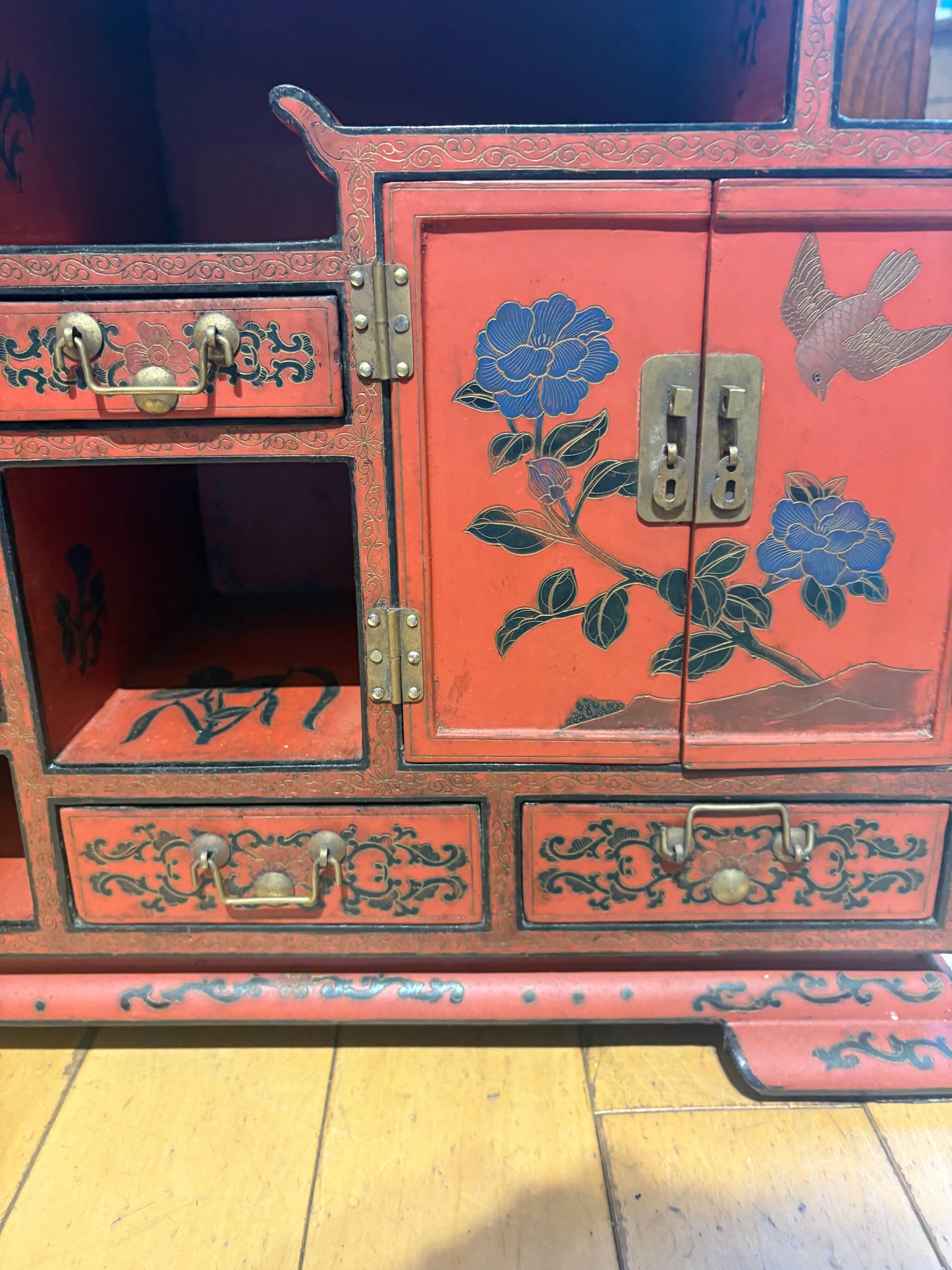 Low Red Painted Cabinet with Small Drawers and Nooks