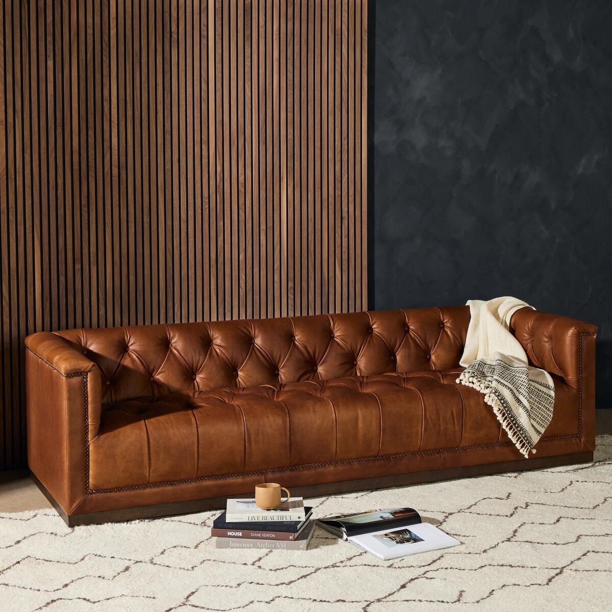 Tufted Distressed Sofa with Bronze Detail