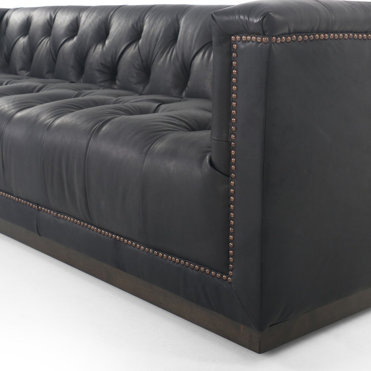 Tufted Distressed Sofa with Bronze Detail