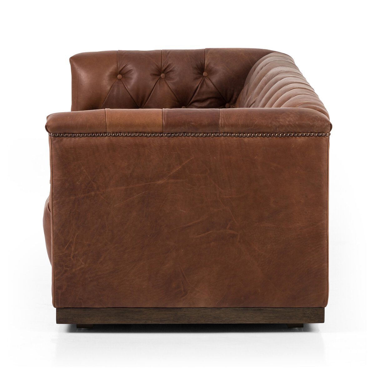 Tufted Distressed Sofa with Bronze Detail