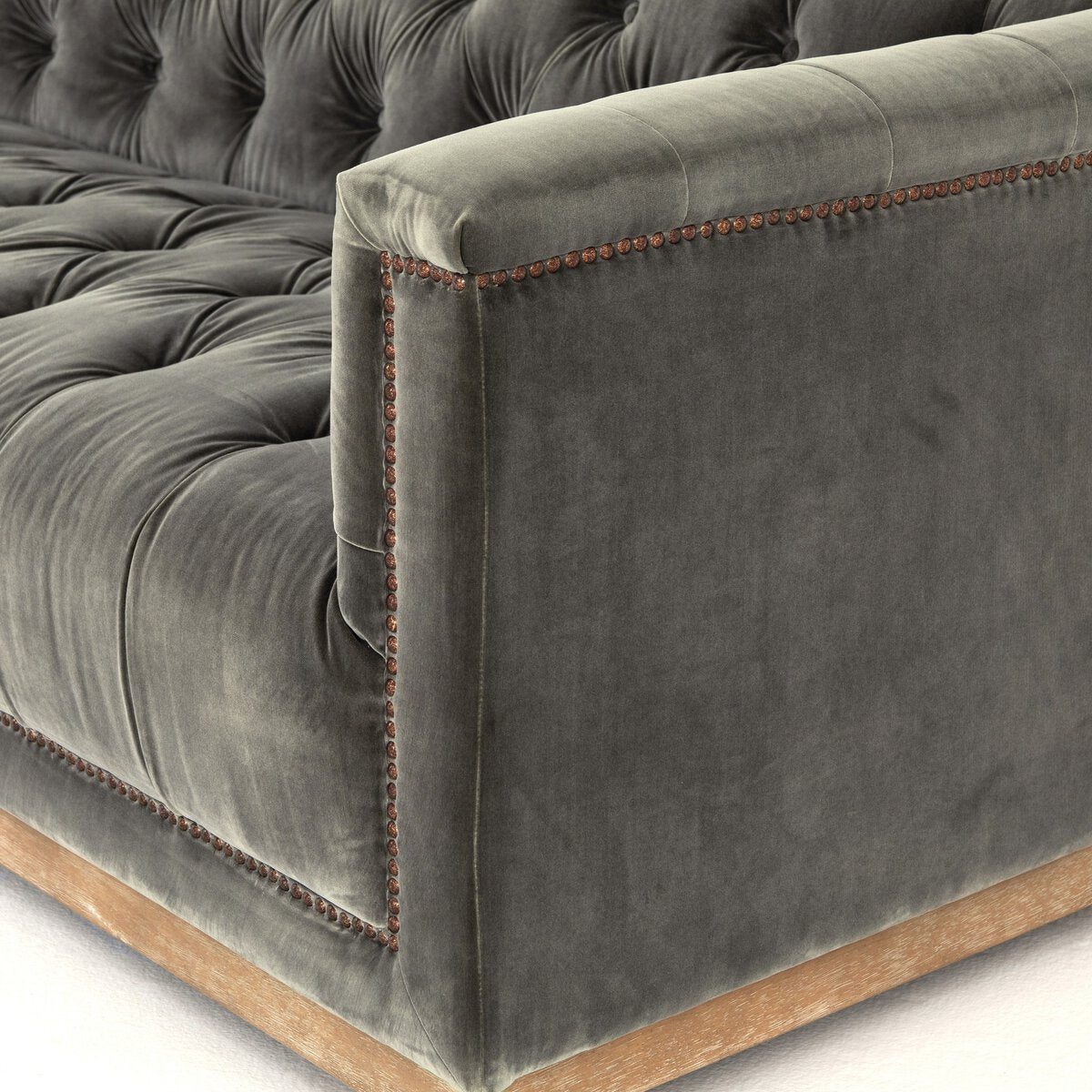 Tufted Distressed Sofa with Bronze Detail