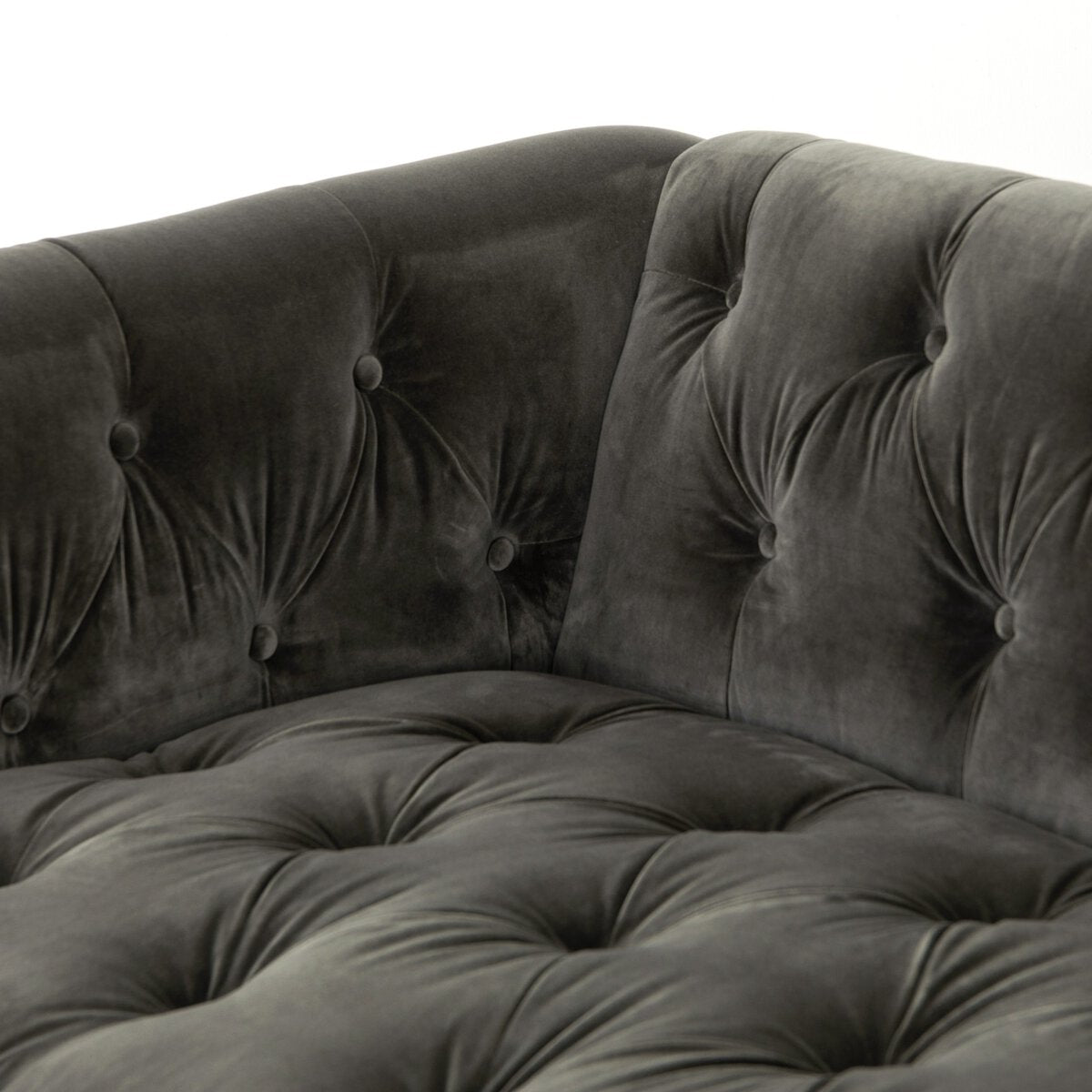 Tufted Distressed Sofa with Bronze Detail