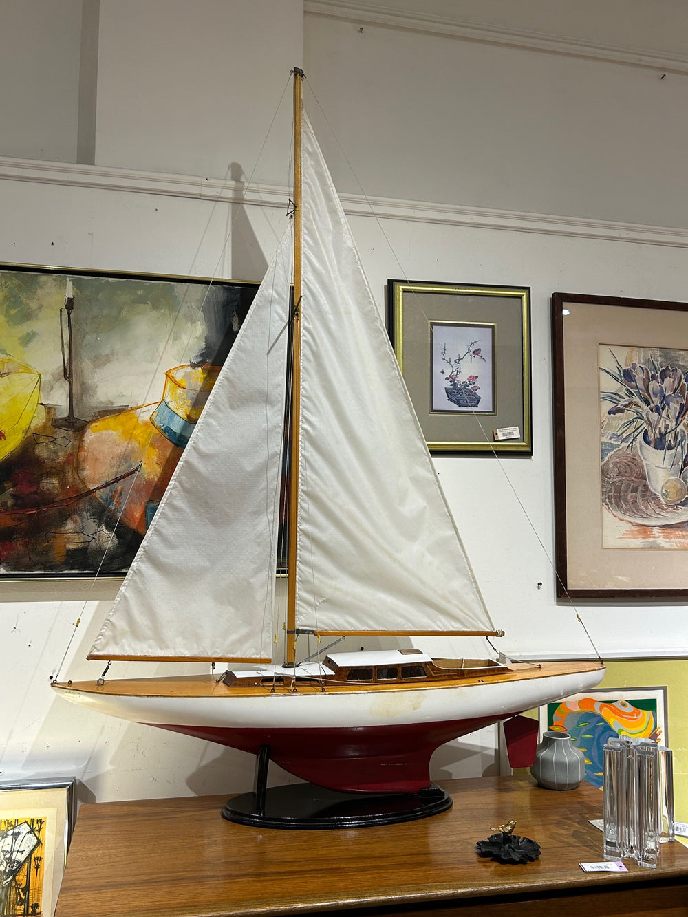 Large Red and White Wooden Sailboat Model on Stand