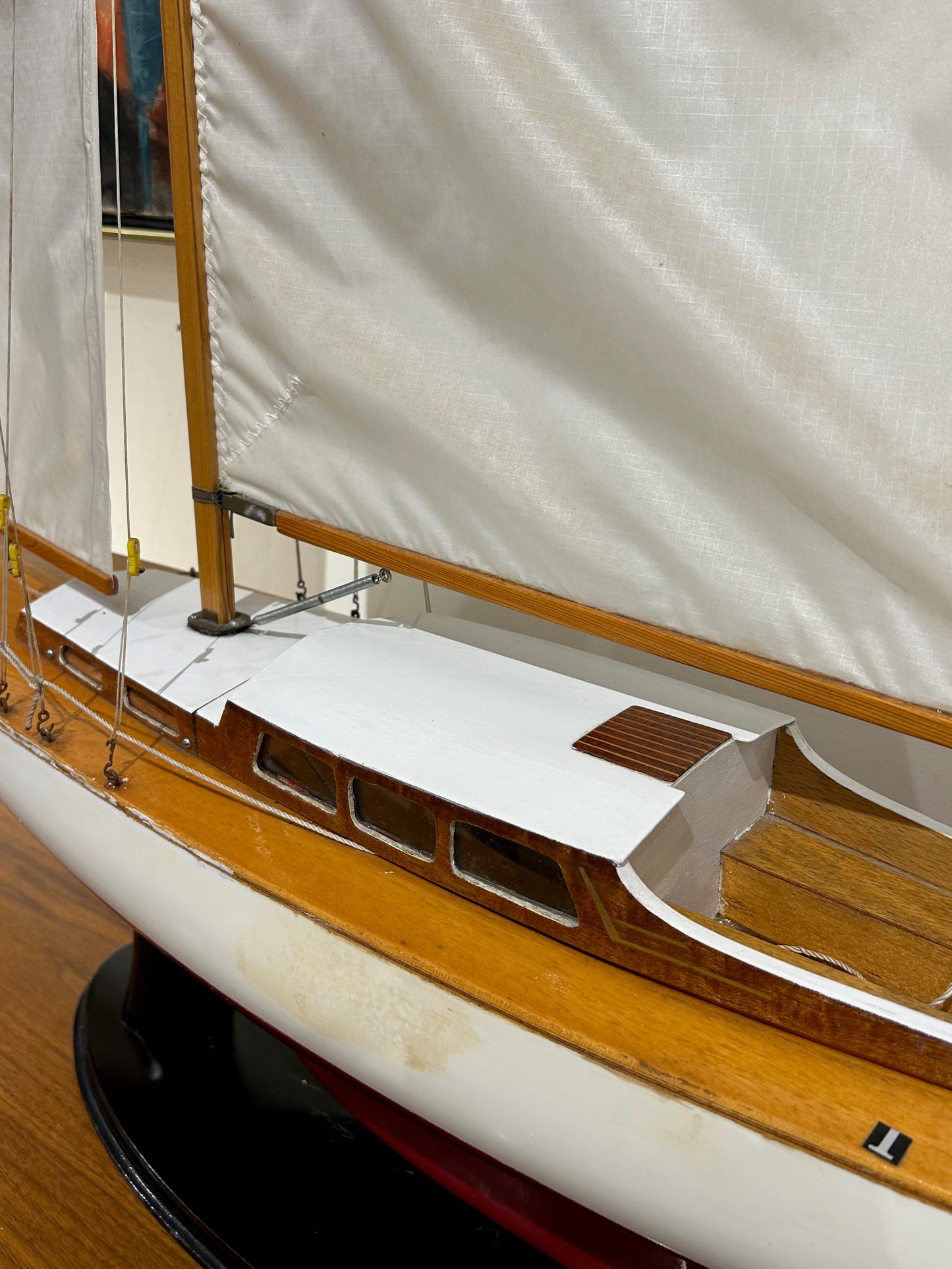 Large Red and White Wooden Sailboat Model on Stand